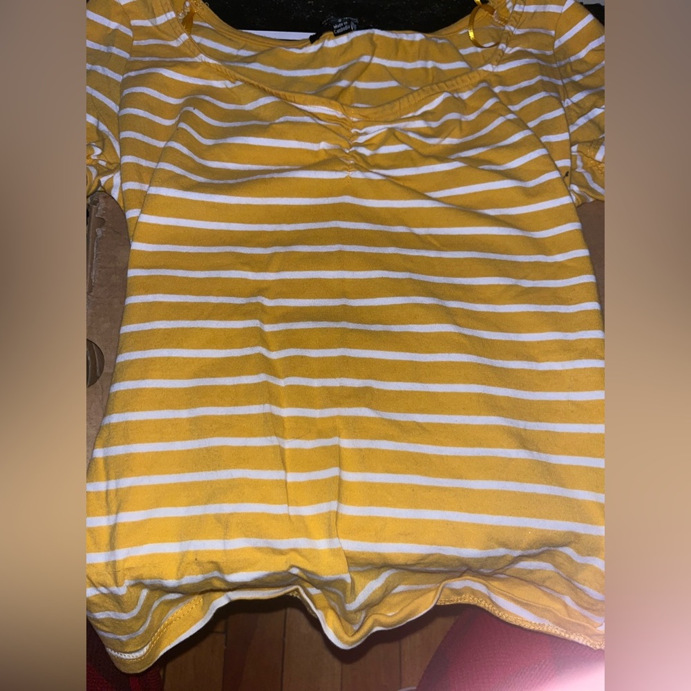 Yellow and white striped short sleeve top with cleavage scrunch.
